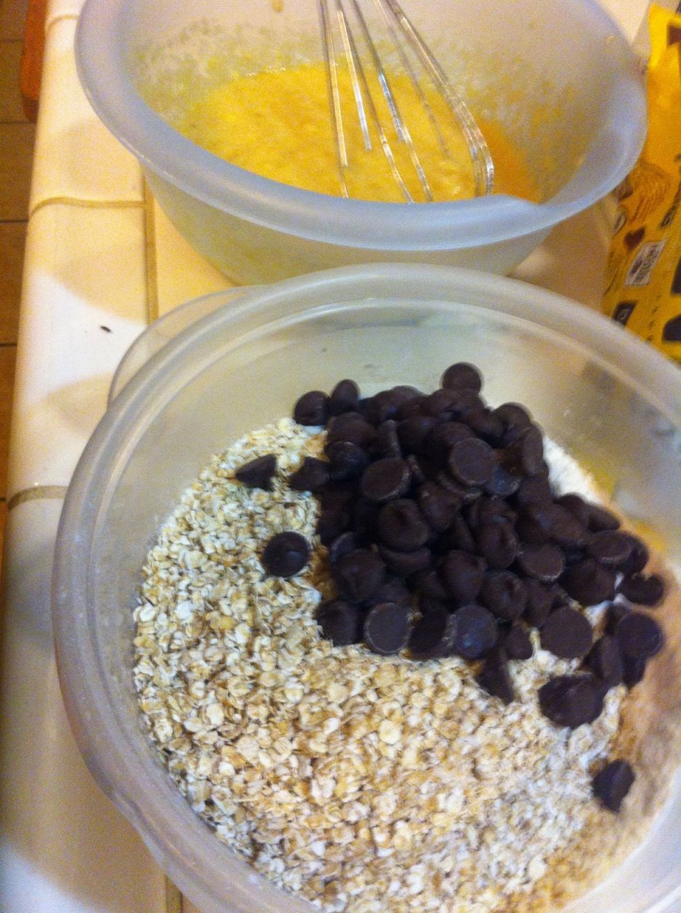 In a separate bowl, mix dry ingredients: sugar, flour, baking soda, oats, and chocolate chips