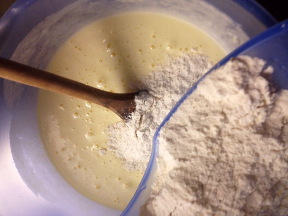 In a separate bowl mix flour and baking powder. Preferably sift the flour mix before adding it to the bowl.