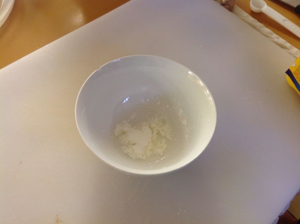 In a SEPARATE bowl mix the corn starch and the water.this mixture is called a slurry. It's function is to thicken sauces (like roux).
