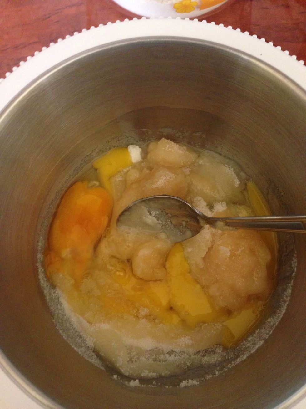 In a separate bowl mix together eggs, sugar, honey