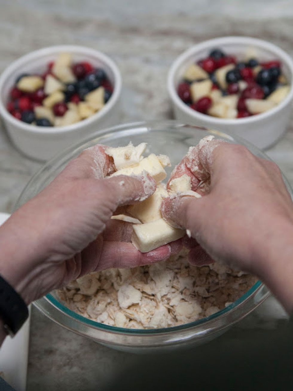 In a separate bowl mix together the rolled oats, the sugar, flour, and salt. Crumble the butter pieces into the rolled oats, flour, and sugar.