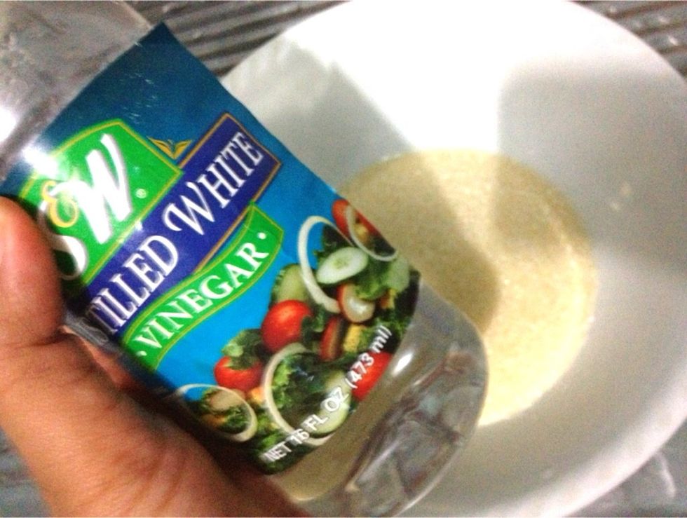 In a separate bowl, stir to dissolve 1 cup + 2 tbsp of sugar with 3/4 cup of white vinegar. The original recipe calls for 1 cup of sugar+1 cup of white vinegar