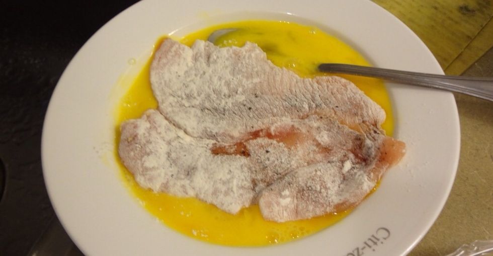 In a separate bowl, take all-purpose flour. Coat the cutlet first in flour (picture missing). Then dip in eggs.