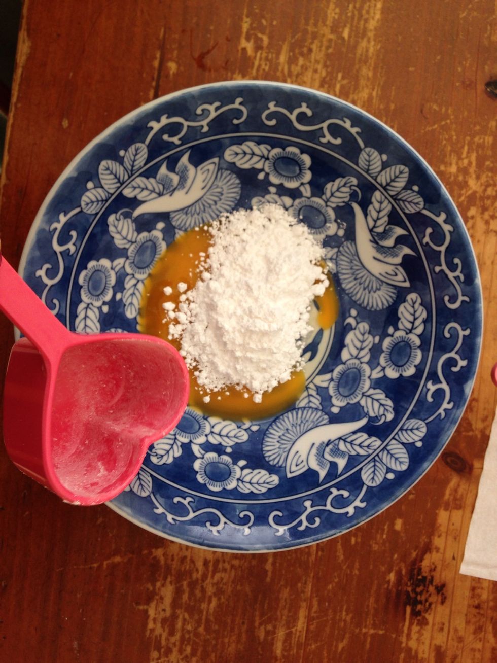 In a separate bowl, use an electric mixer to combine the rest of the icing sugar and egg yolks.