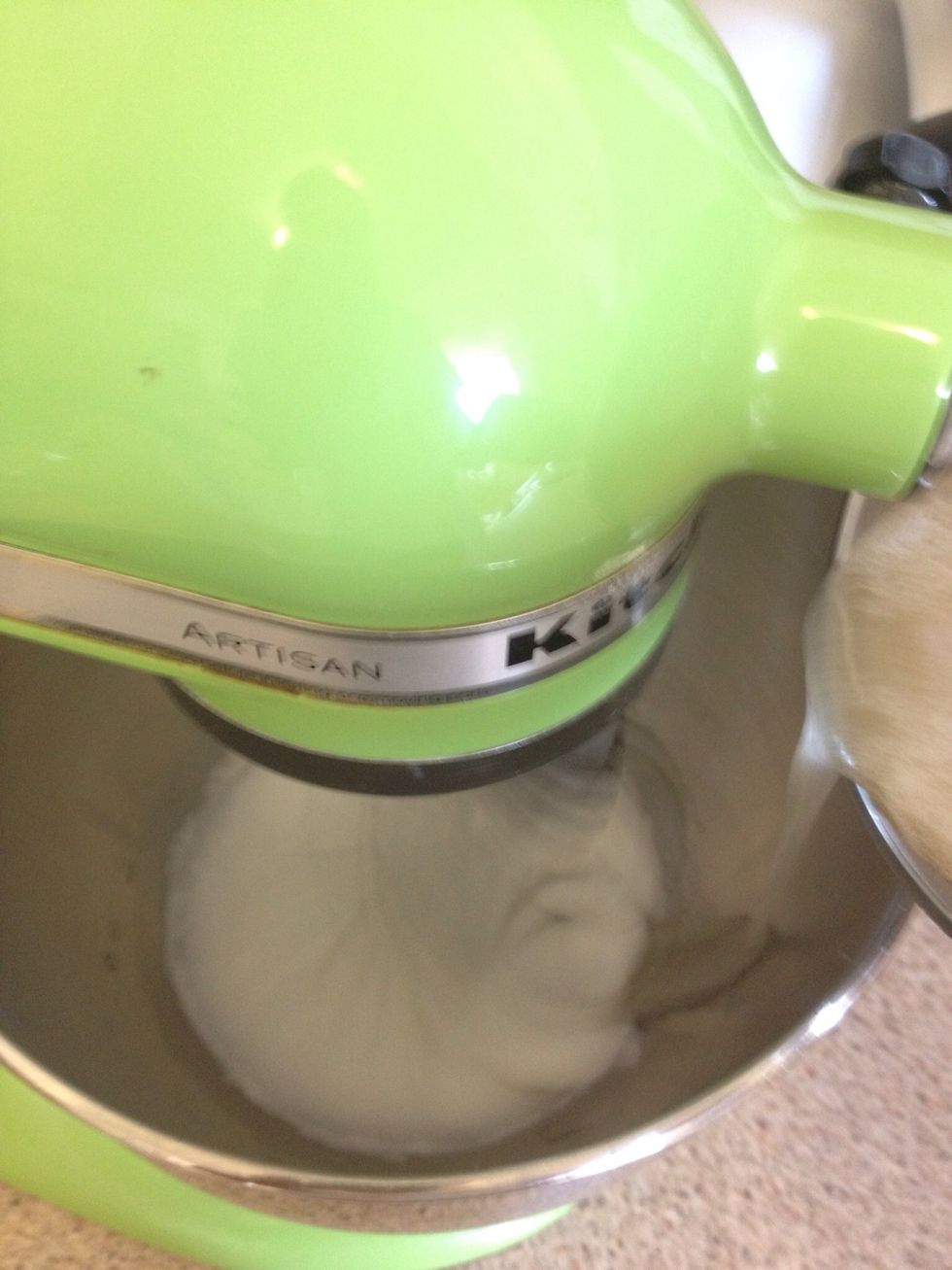 In a separate bowl, whip egg whites on high speed until they form soft peaks. With mixer still on high speed, slowly pour in sugar/gelatin mixture.