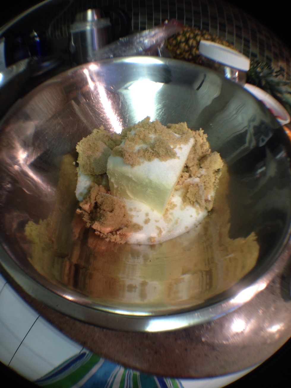 In a separate bowl, whip the butter, white sugar, and brown sugar until creamy