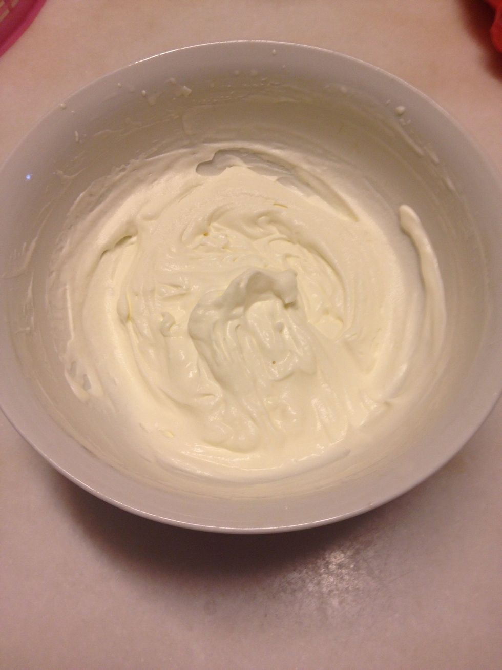 In a separate bowl, whip the cream until soft peak and set it aside.