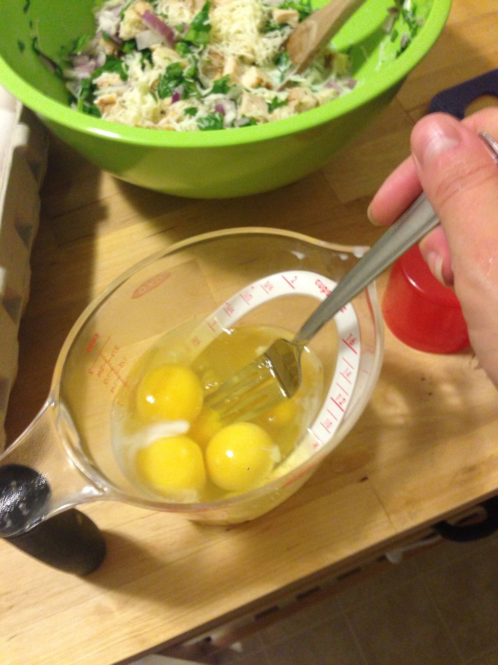 In a separate cup, add 8 eggs and whisk.