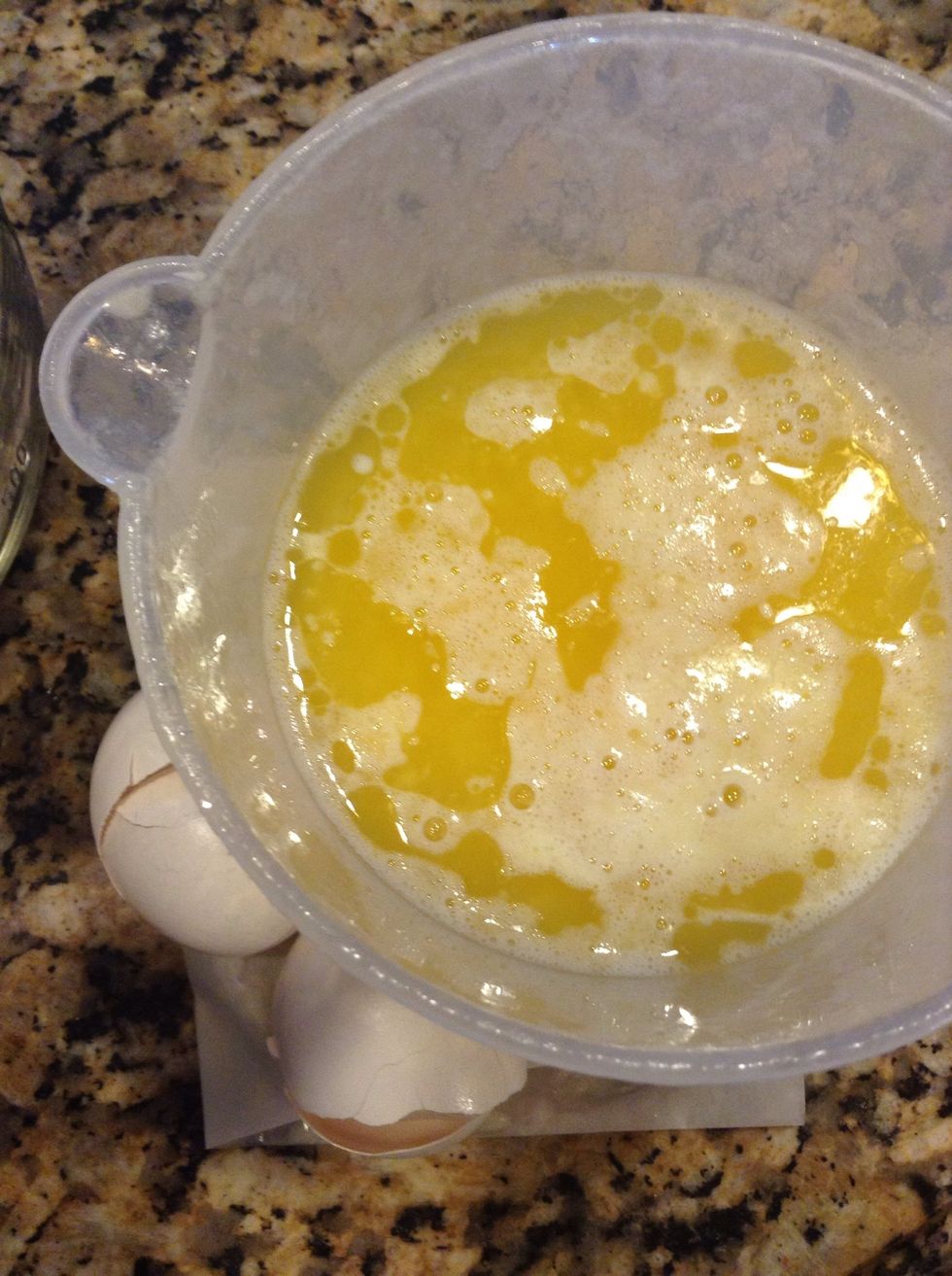 In a separate dish, melt 2 sticks butter. Add 1 1/4 c milk and 2 eggs. 1 TB vanilla. Mix well