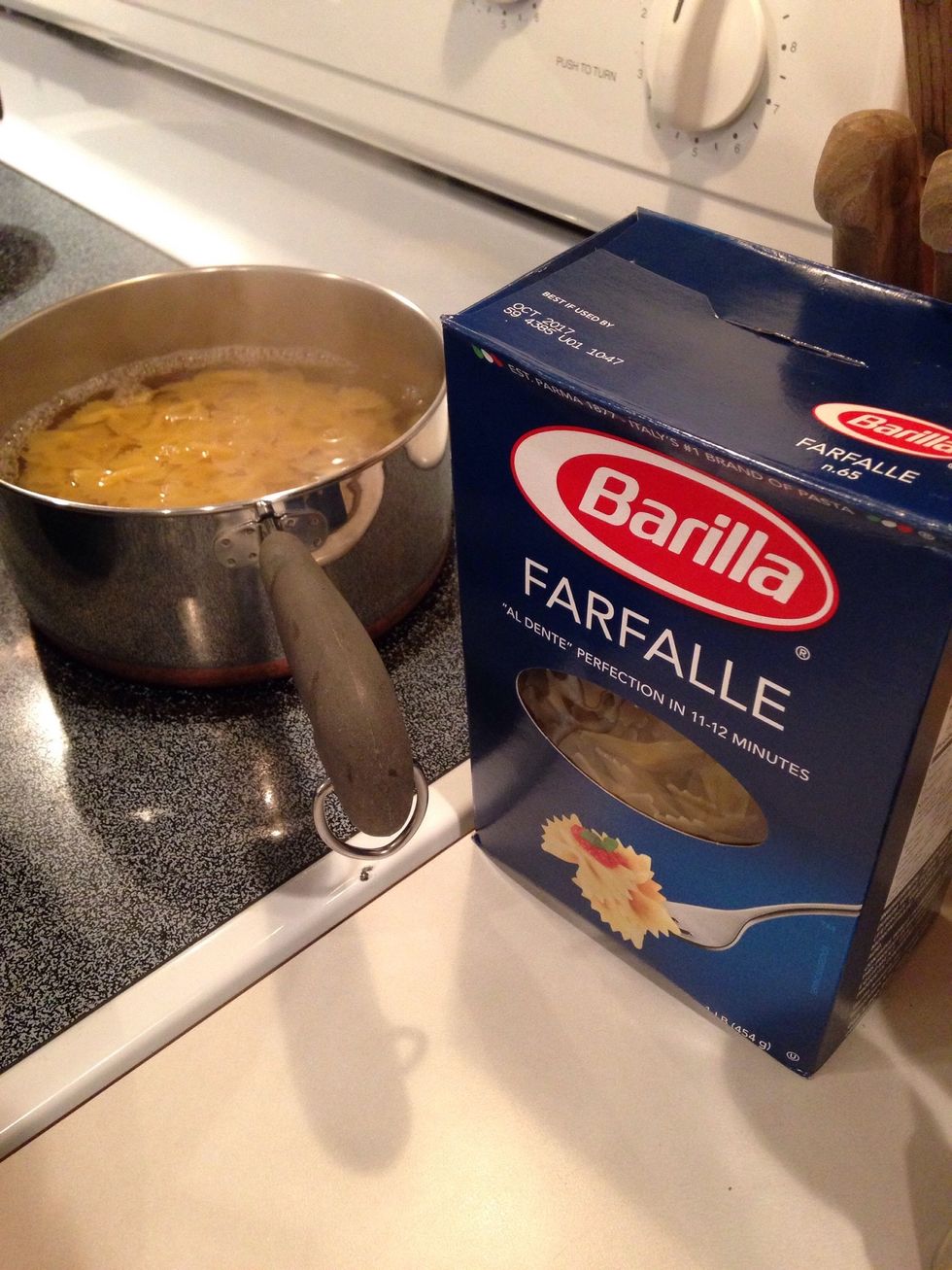 In a separate pot, cook bow tie pasta according to direction on the box.