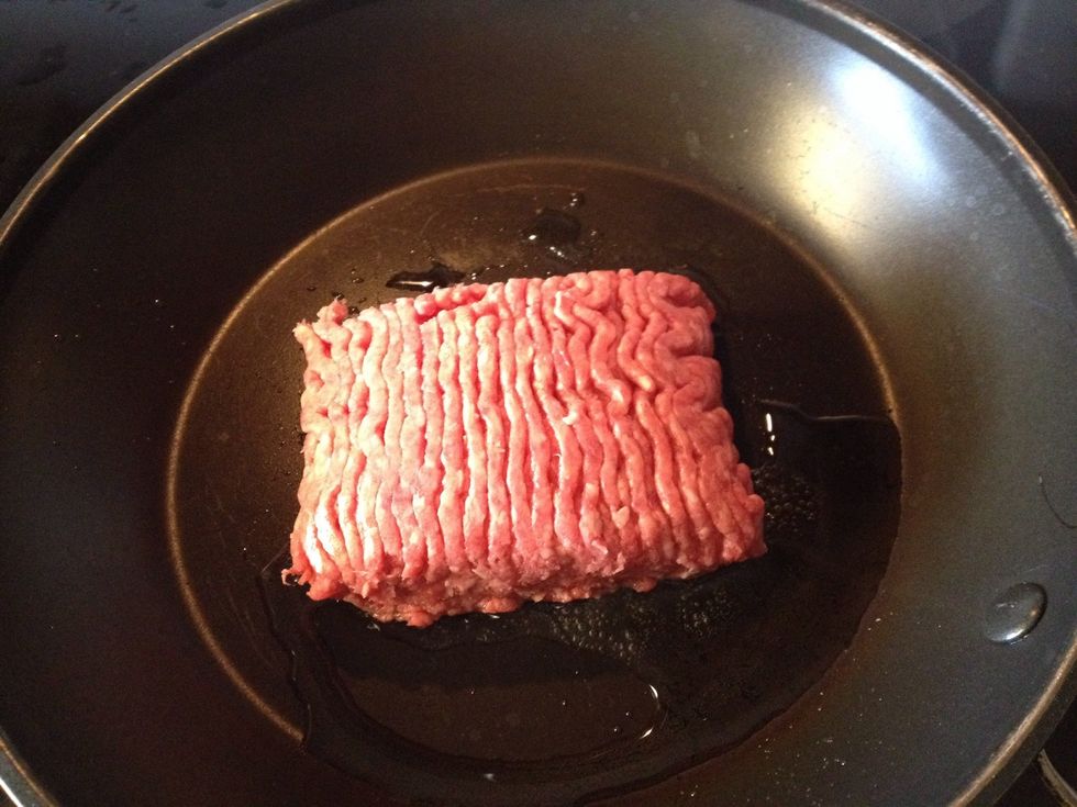 In a separate skillet, brown the beef