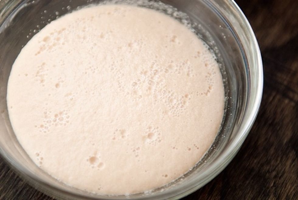 In a seperate bowl combine the sugar yeast and warm water ( gets puffy)