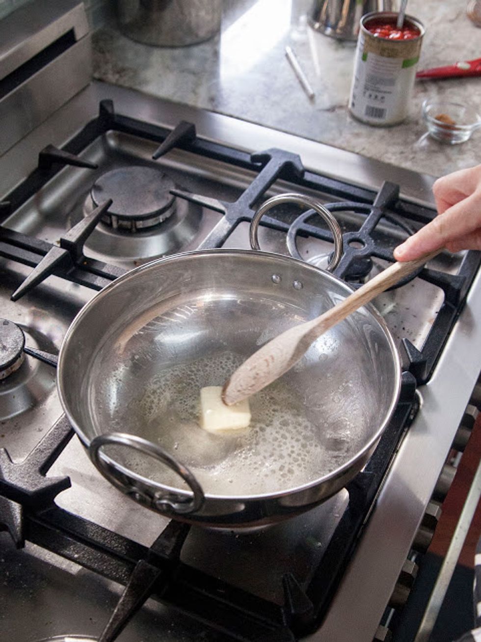 In a skillet or kadhai heat the butter or ghee.