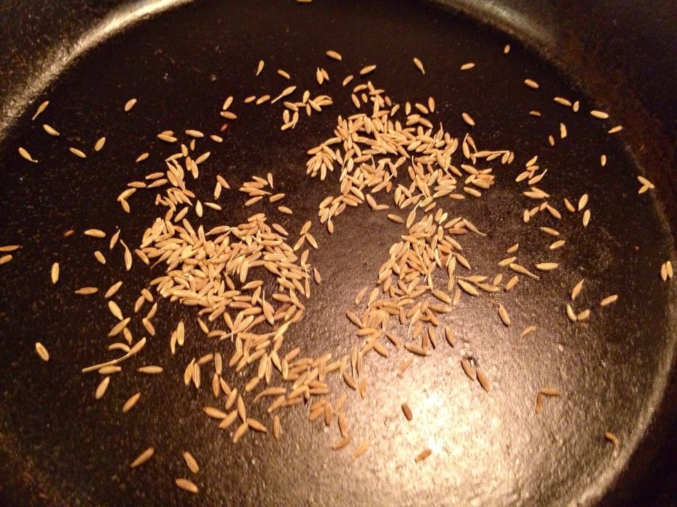 In a skillet, roast the cumin seeds for a minute or so. If you cannot find cumin seeds it works with the normal kind, then just add it to the onions directly.