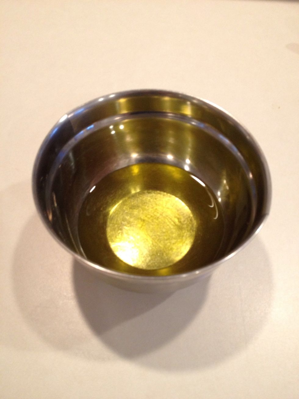 In a small bowl, add olive oil.