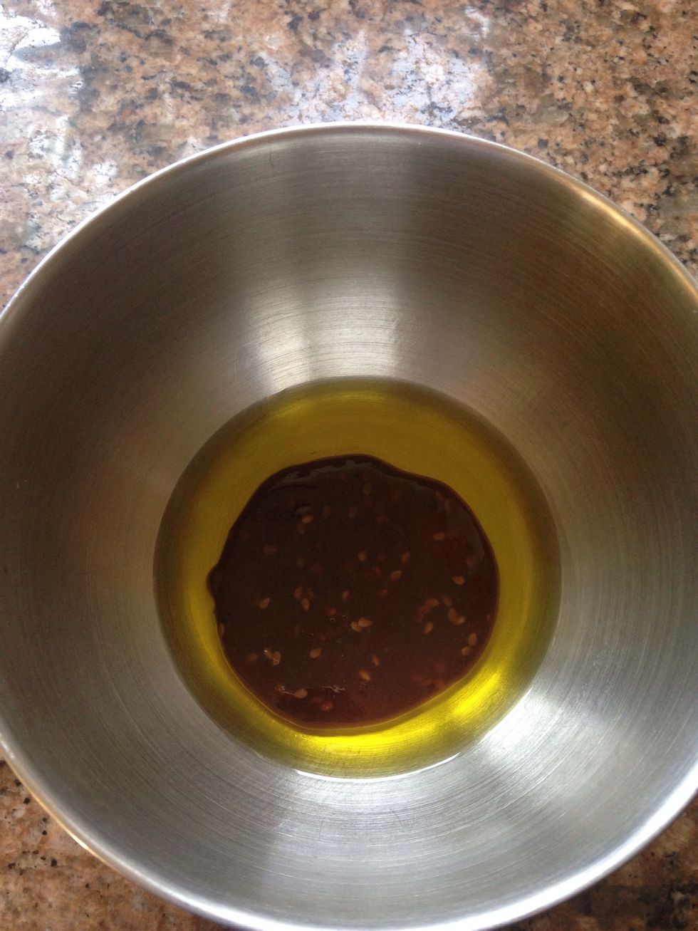 In a small bowl add sesame ginger dressing to olive oil. I eyeballed this but tried to give measurements in the supplies. You may feel like you need to add more of any ingredient.