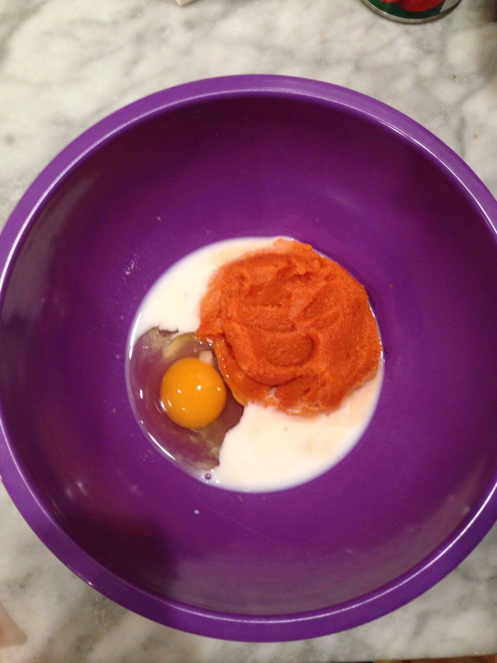 In a small bowl are the pumpkin, egg and milk