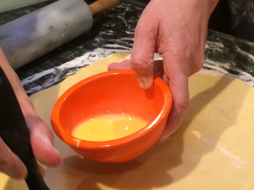 In a small bowl beat 1 egg with 1 tablespoon cream. Set it aside. We'll be using this shortly as our egg wash.