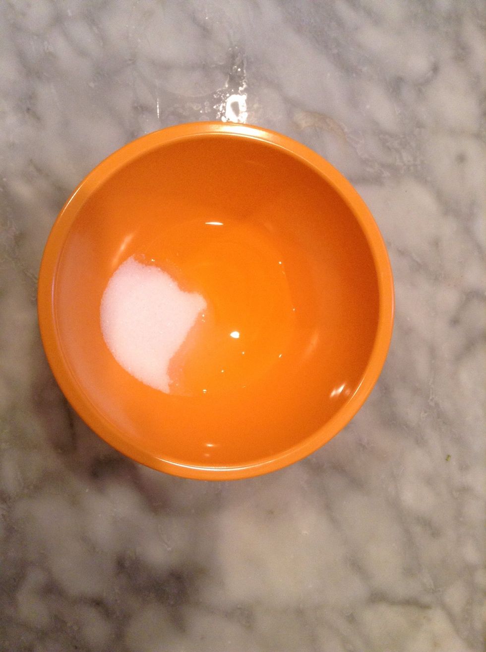 In a small bowl combine egg whites and sugar