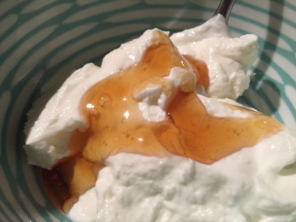 In a small bowl, mix your desired amount of yogurt with honey to taste.