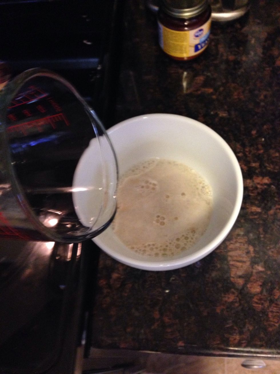 In a small bowl, place 1/2 cup warm water, sugar, and yeast. Do not stir and let it sit for 5 min. After the 5 min stir.