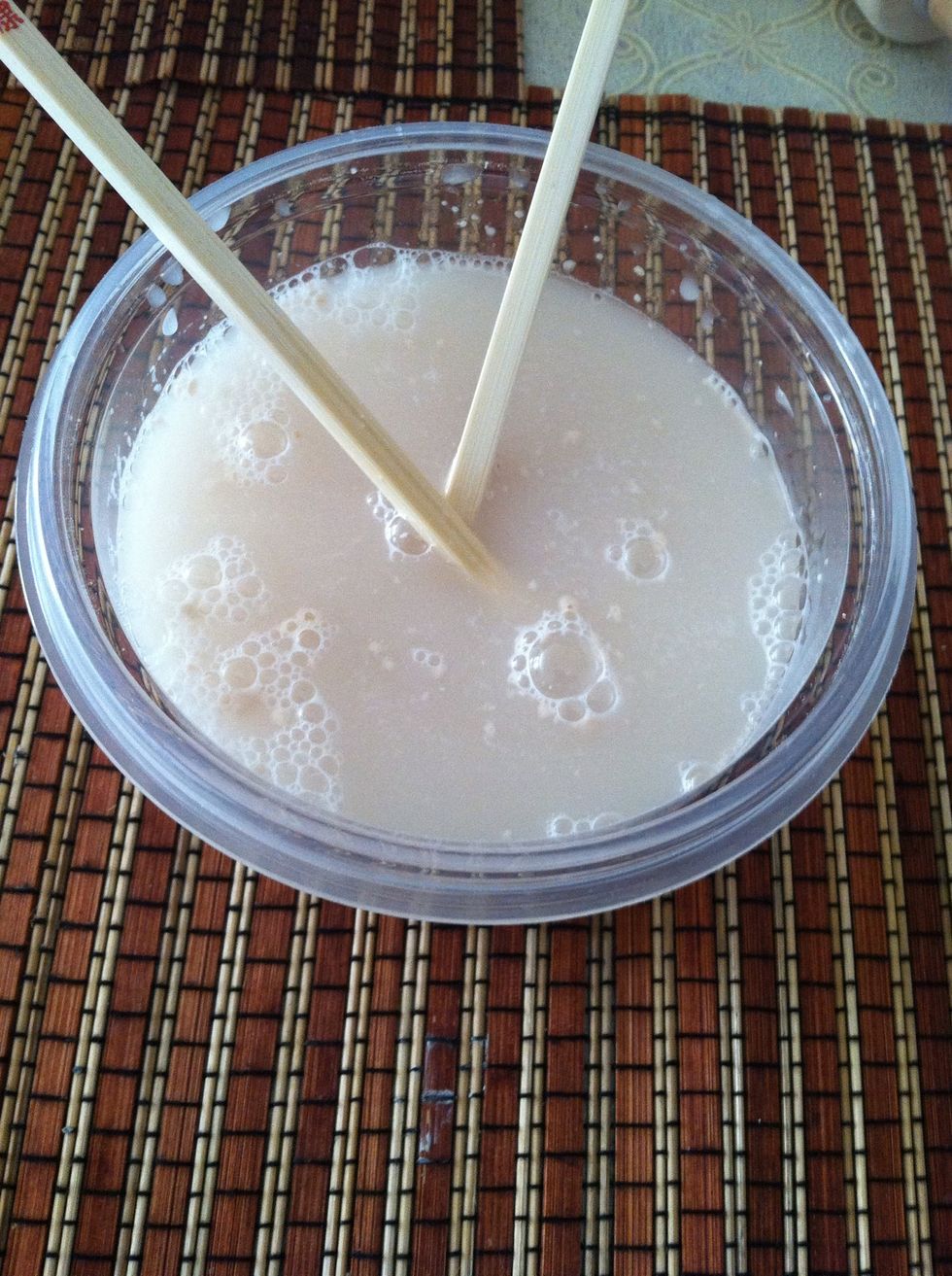 In a small bowl pour in 2 cups of warm water, 1 pack or 1 tbs of instant rise yeast, and 1 tbs of sugar. Mix and set aside.