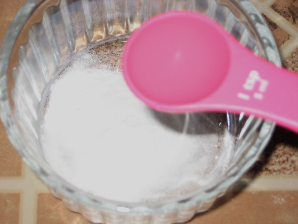 In a small cup add the baking soda then take the vinegar and add to the powder.