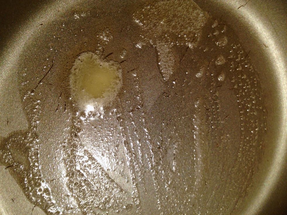 In a small frying pan over medium heat, melt a bit of butter. Be careful not to burn it!
