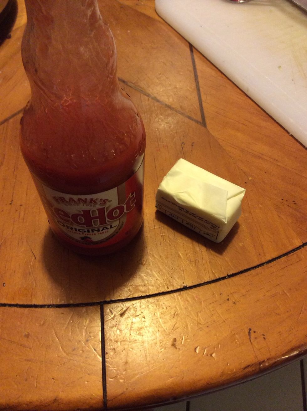 In a small sauce pan on med-low heat, melt butter and add hot sauce...