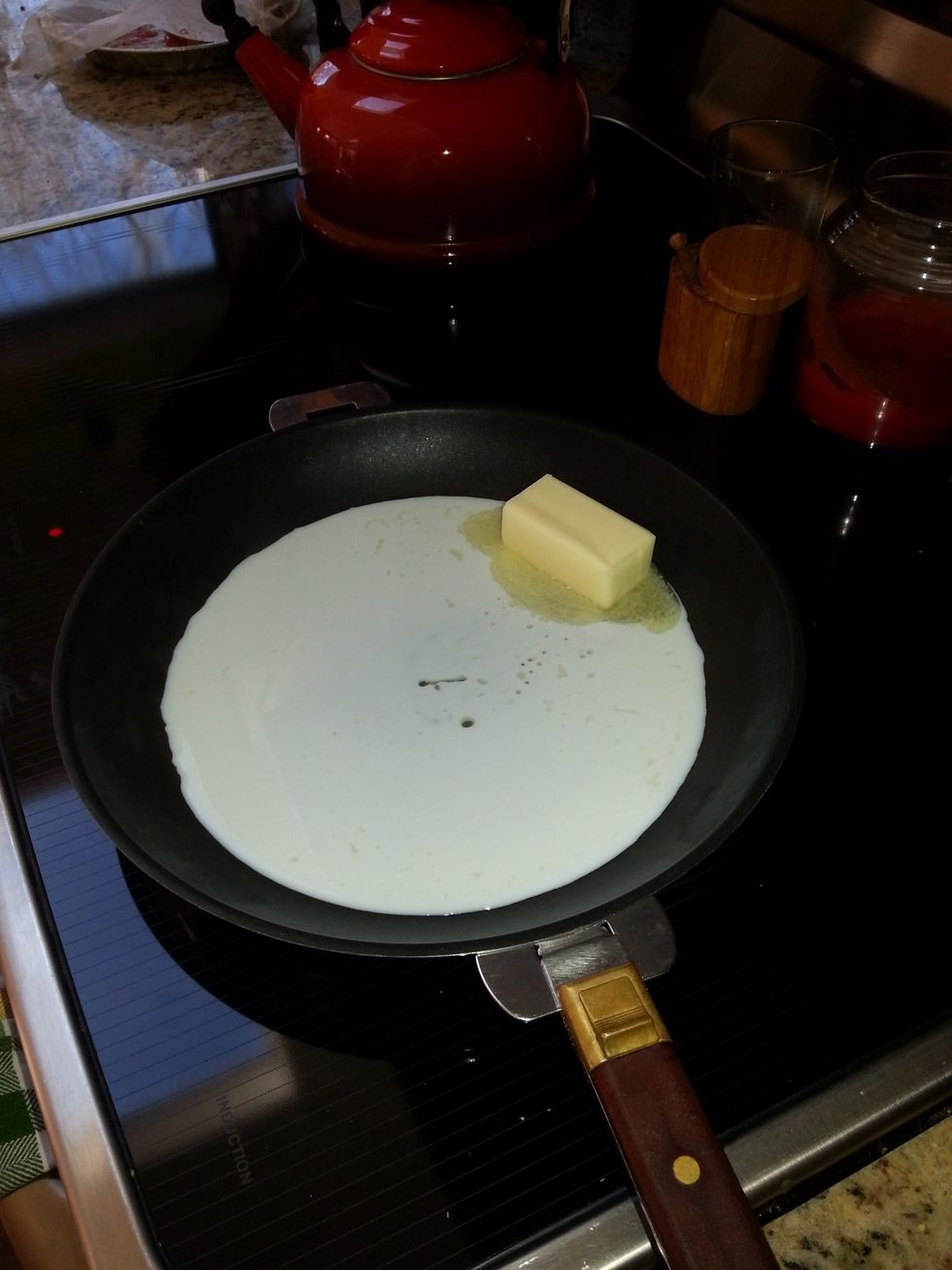 In a small saucepan, melt together milk and butter until butter has just melted