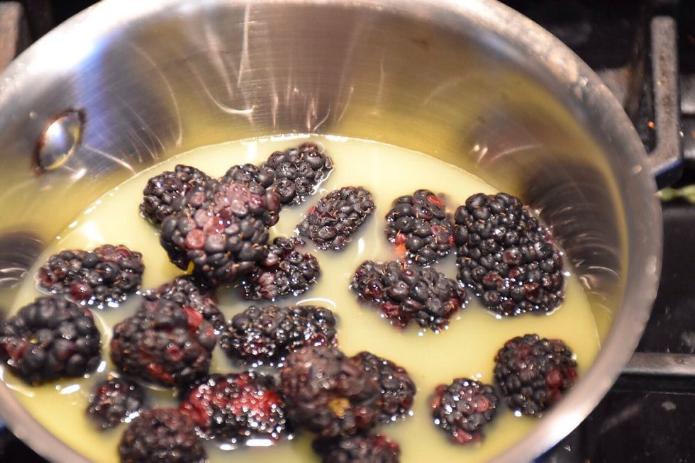 In a small saucepan over medium high heat add orange juice and blackberries. Cook until the blackberries are soft approximately 10 min.