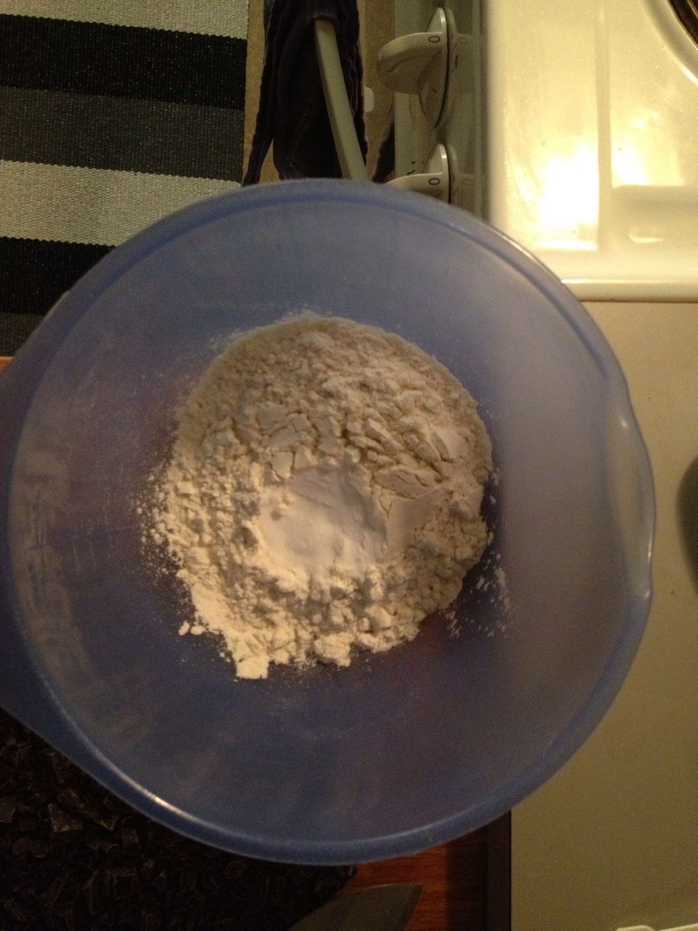 In a smaller bowl mix flour and bicarbonate.