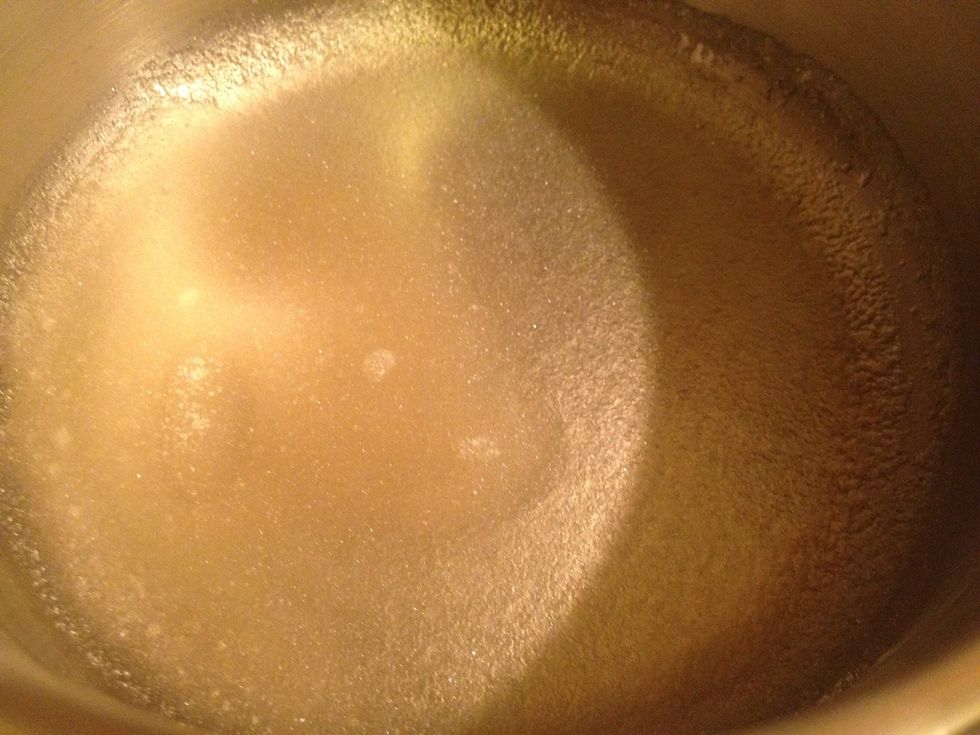 In a smaller saucepan pour the water, add the gelatin and let it bloom for a minute. Then start warming it on low heat, until gelatin dissolves. Turn off the heat, add a little whipped cream, mix it.