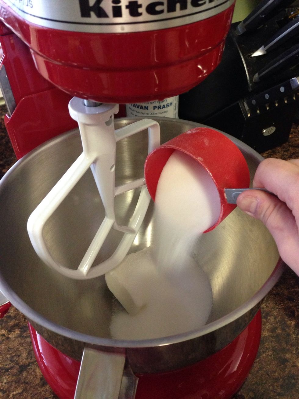 In a stand mixer, cream together the sugar and shortening.