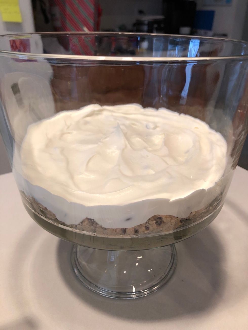 In a trifle dish, scoop 1/3 of the cookie dough mixture into the bottom and spread evenly. Add 1/3 whipped cream mixture on top.