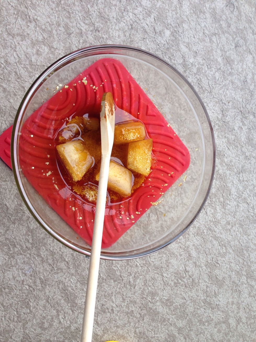 In a well ventilated area and wearing the safety gear, slowly add the lye to the frozen tea. Stir. The lye will react with the tea and create heat that will melt the ice.