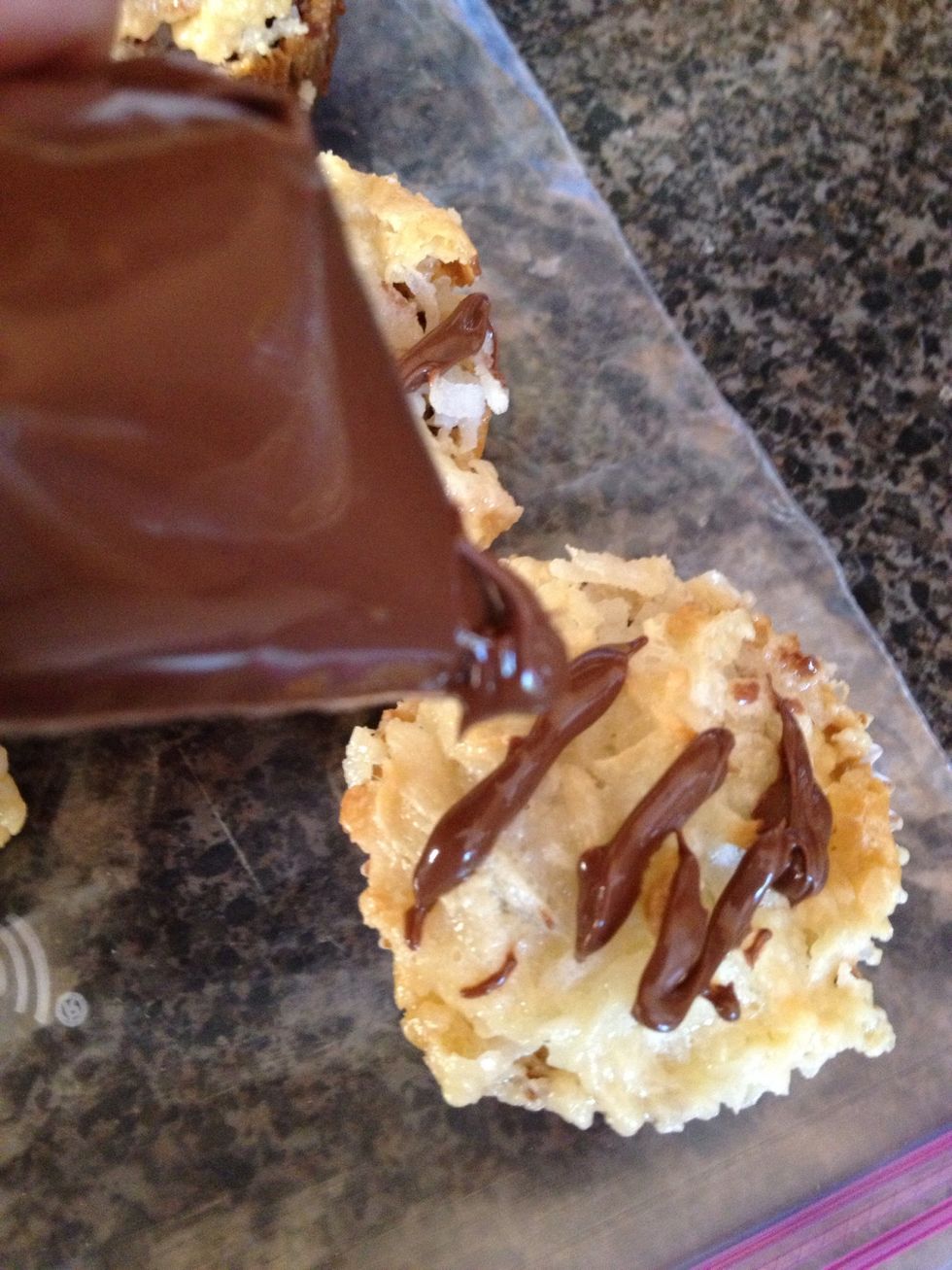 In a zip lock bag put your Nutella and drizzle over the coconut or you can heat up your own chocolate