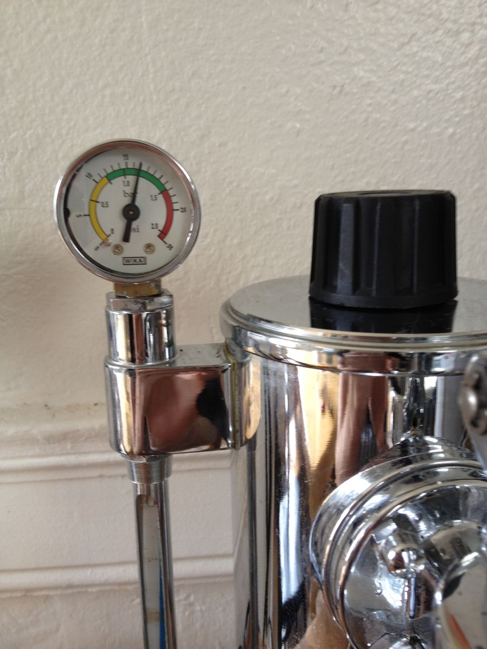 In about 10 minutes the pressure will reach 1 bar. Check your pressure gauge or wait until the boiling/tinker sound from inside the tank stops.