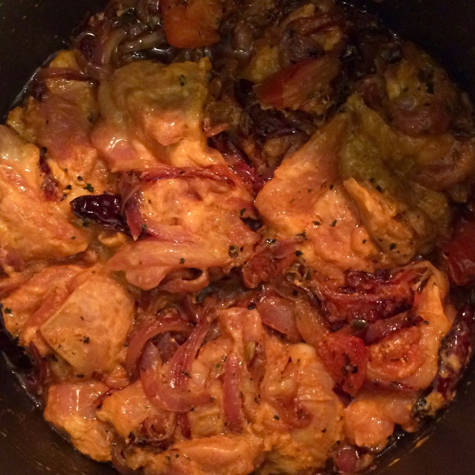 In about 7-10 mins. add the marinated chicken to the onion and spices mixture. Also add the ground cumin and coriander powder. Mix well.