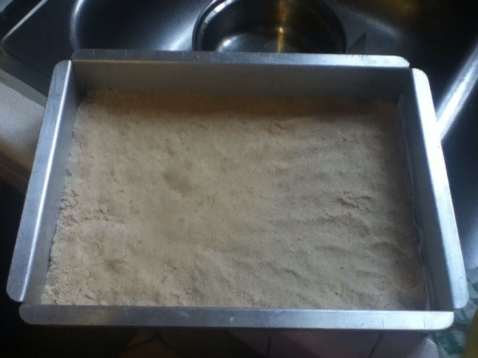 In an 8x11 pan put parchment paper. Spread the cookie base all over the pan and padded it down. It will look something like this. Bake this for 10 to 12 min. \ud83d\ude0a