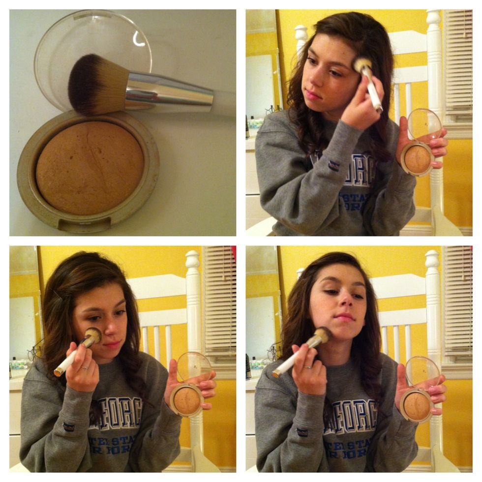 In an E3 motion apply a bronze to your face and neck with a big fluffy brush.