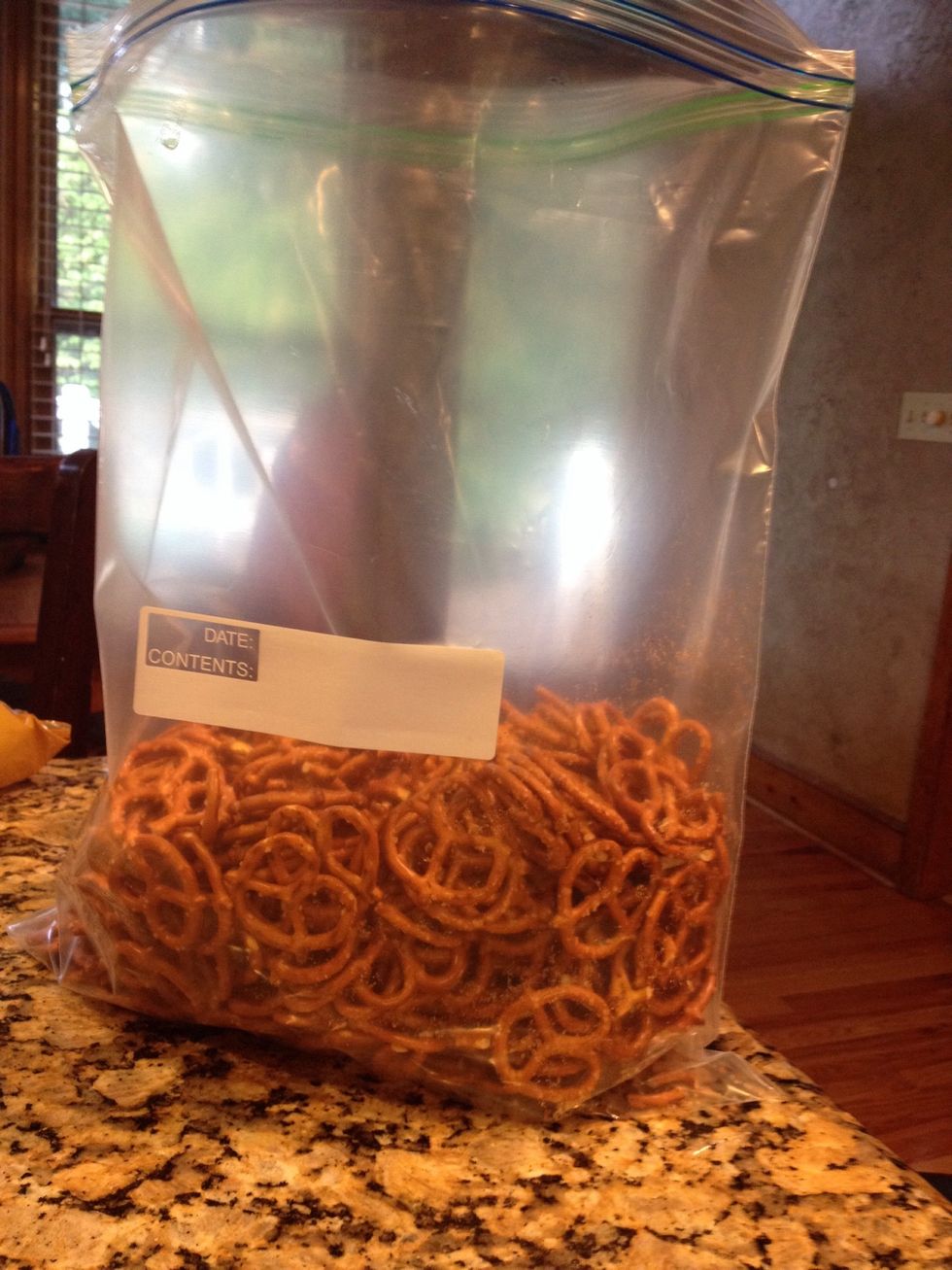 In an extra large zip bag, add a pound of small pretzels twists