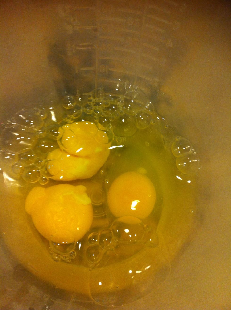 In another bowl, a few eggs (beaten) and a splash of water.