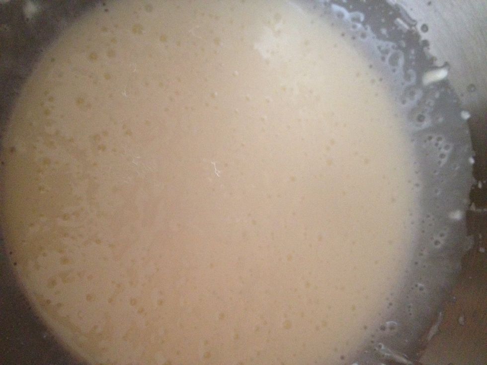 In another bowl, beat the sour cream until it's fluffy, and slowly add the cup of sugar to it. Tip: make sure to scrape the bottom of the bowl because sugar tends to aggregate there.