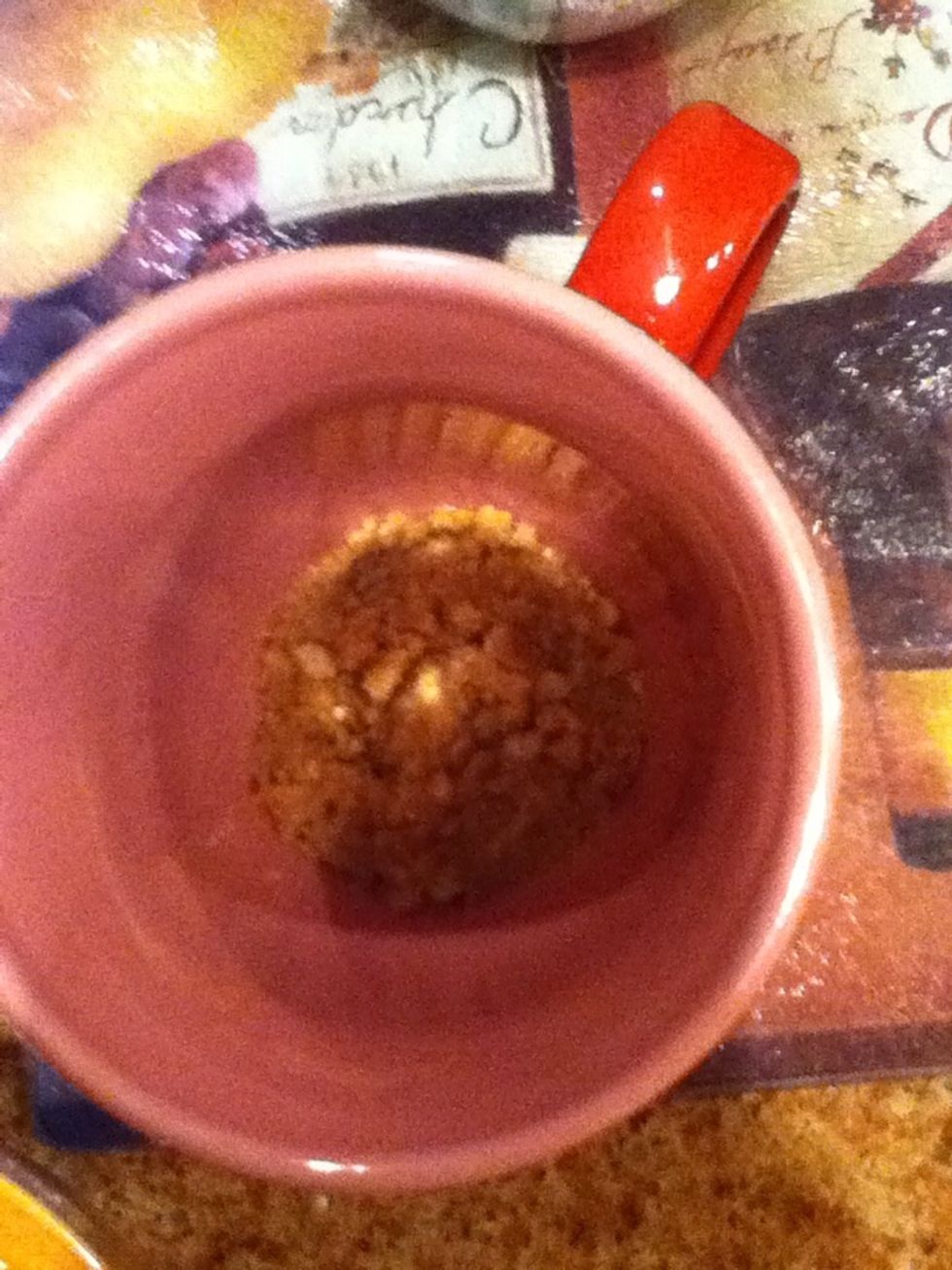 In another bowl, Melt 1/2 tbs. butter and mix with 2-3 tbs. crushed graham crackers until moist. Press into bottom of mug.