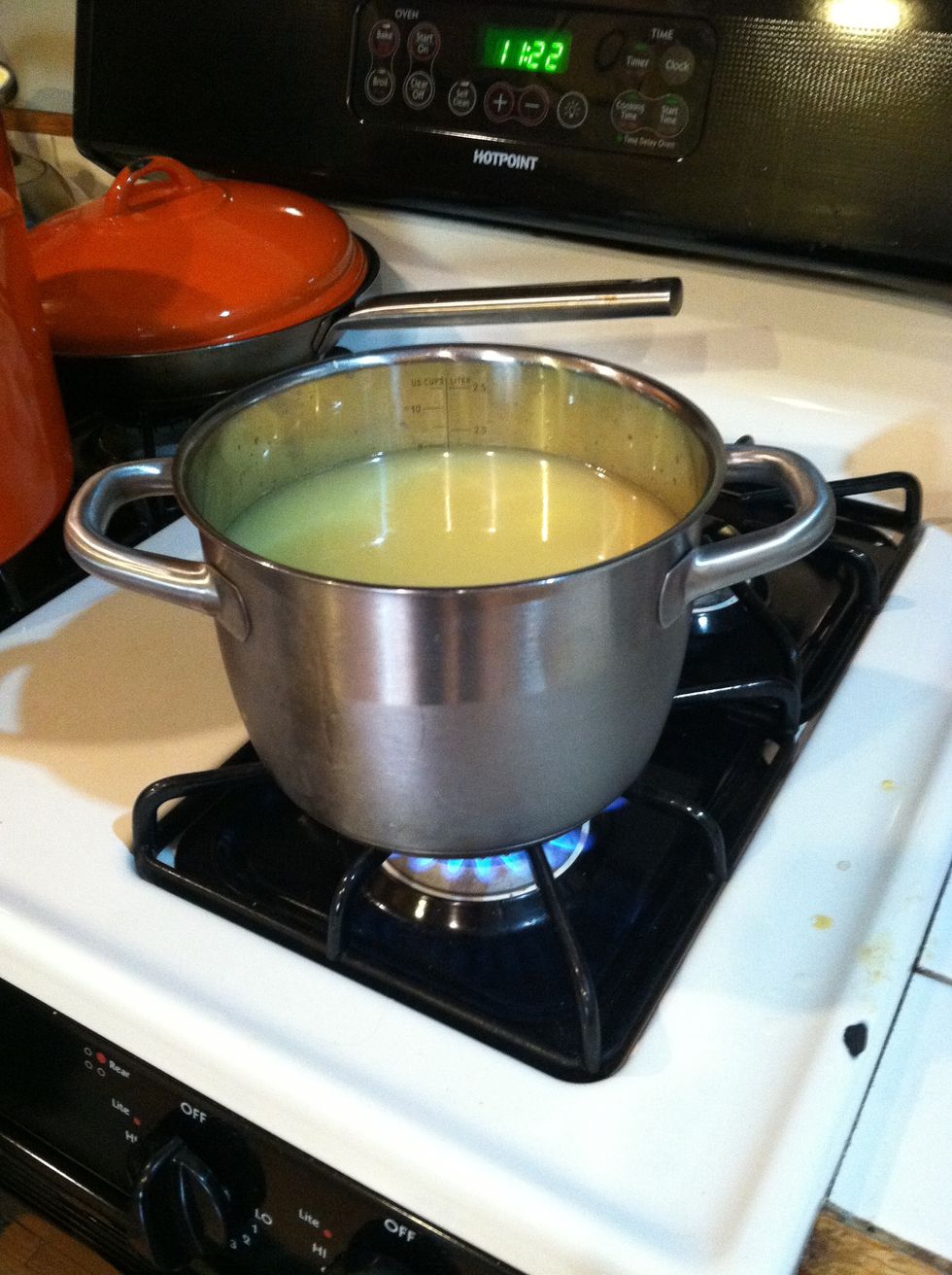 In another medium sized pot, add chicken broth and heat it (but don't boil it) while cooking veggies in other larger pot.