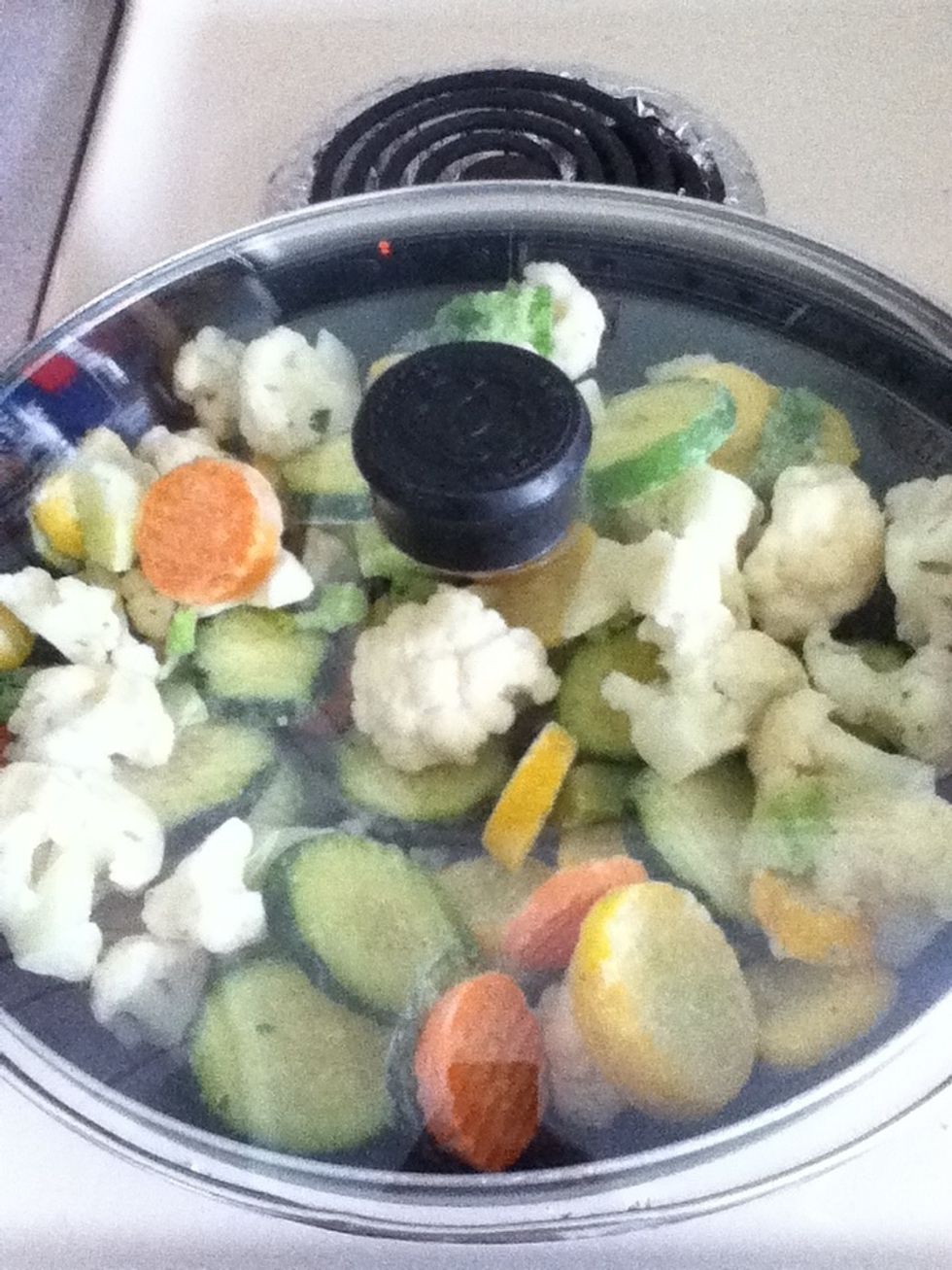 In another pan, allow the frozen vegetables to defrost (med-low)