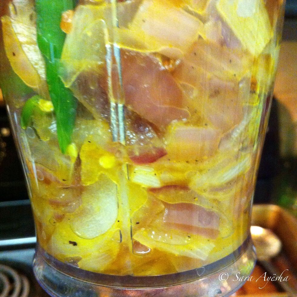 In another pan fried onions until translucent along with green chillies. If you don't like it spicy cut out on green chillies. Added turmeric powder to it.