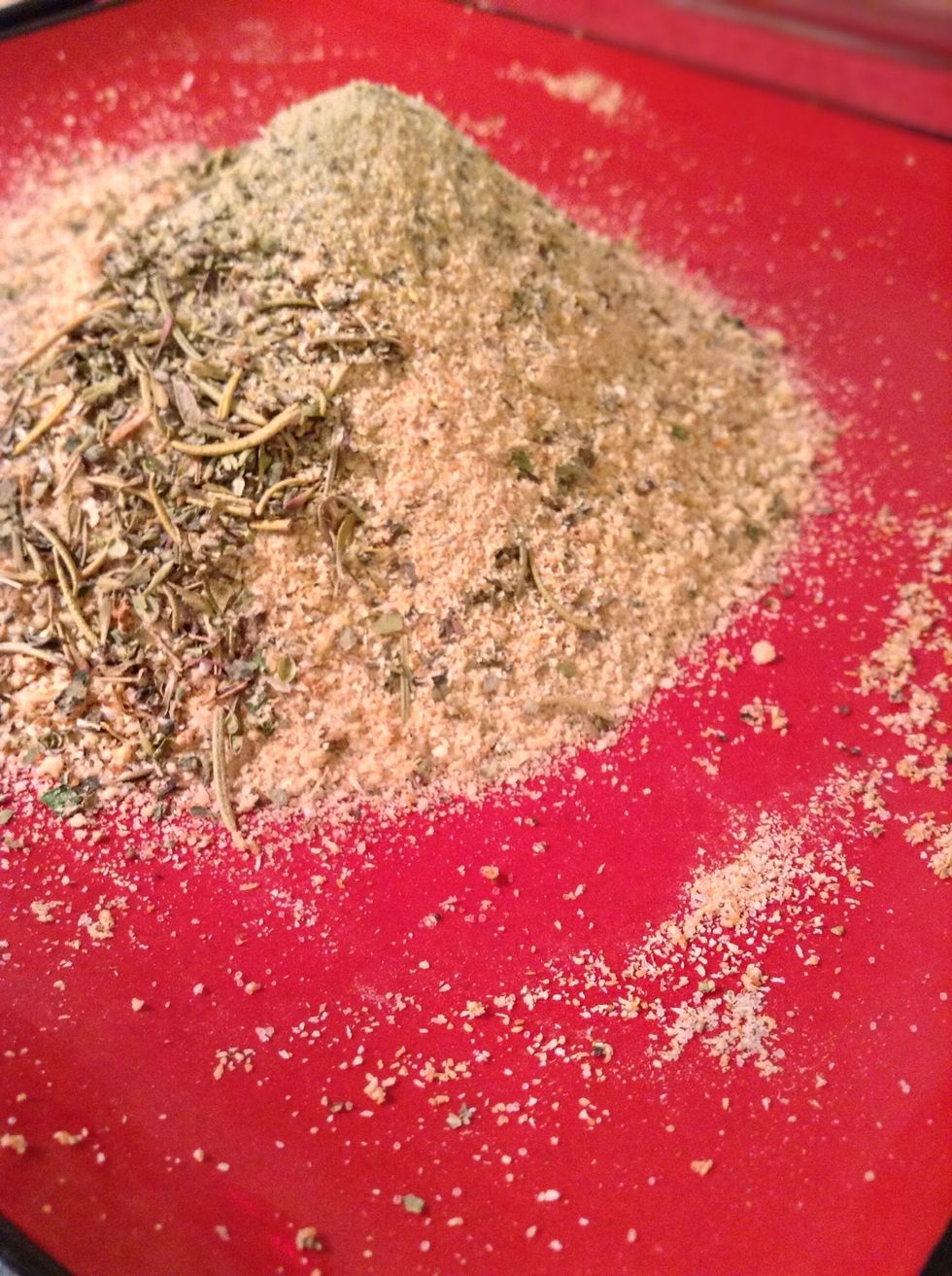 In another shallow plate mix together the bread crumbs, 1 tablespoon of Italian seasonings, 1 tablespoon of garlic powder and 1 tablespoon of seasoning salt. Make sure to mix it well :)!!