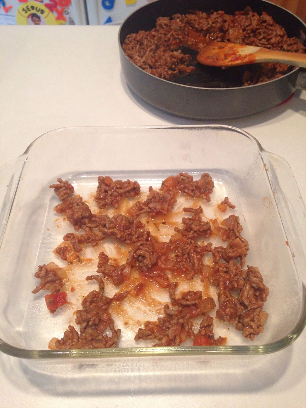 In baking dish, add a small amount of hamburger mixture.
